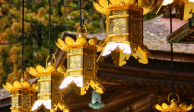 Golden lanterns under the eaves of a temple roof on Mt Koya, Wakayama Prefecture. [OC]