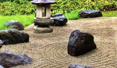 Small zen rock garden surrounded by greenery on a rainy day in Kakunodate, Akita Prefecture [OC]