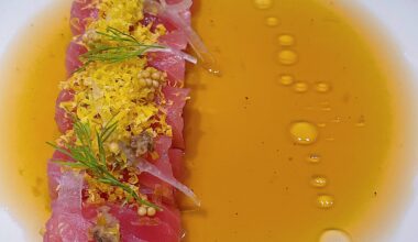 Tuna crudo. Sliced onion,duxelles,cured egg yolk,mustard seed,dill ,umami vinaigrette w house soy