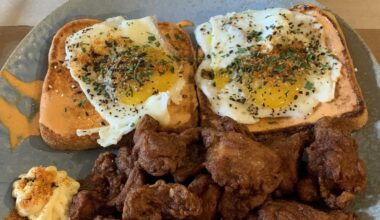 Something a little different, over easy eggs atop Sriracha mayo butter toast topped with furikake, nanami togarashi, and parsley served with chicken karaage. Oolong tea and beer for the bev