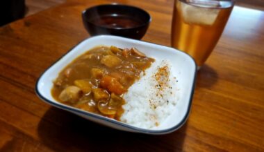 Beautiful Curry Rice I made, with sliced pork chipolatas and a side of miso soup