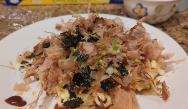 Katsuobushi dancing on top of homemade okonomiyaki