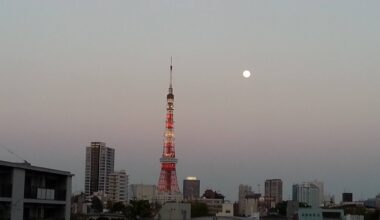The moon rising behind Tokyo Tower. View from Roppongi Hills.