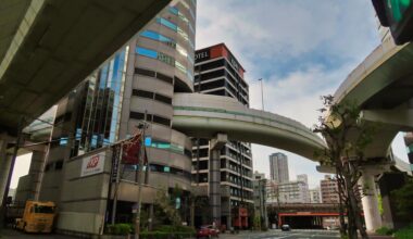 Highway passing through a 16-storey building. Located in Osaka.