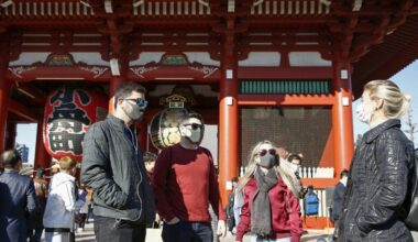 Japan to ask foreign tourists to wear masks, take out insurance