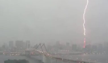 Lightning striking Tokyo Tower. Taken from the observation orb at Fuji Television on Odaiba.