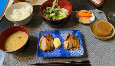 Curry roasted chicken thighs with a curry mayo dipping sauce, miso soup, rice, salad, carrots with a sesame dipping sauce, and simmered daikon.