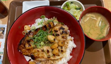 Pork Teriyaki topped with garlic gloves and onion chives with a side menu of miso soup and pickled vegetables (Sukiya)