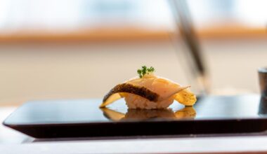 Spanish mackerel nigiri with daikon and gronions