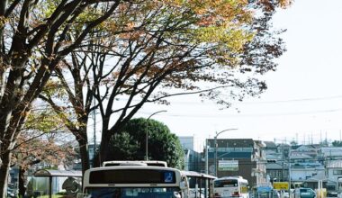 Bus under fall colors in Takao station