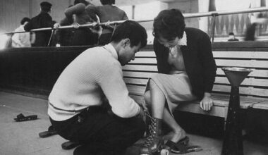 A Young Man Helping His Date Into Her Skating Kit, Tokyo, 1959. Photograph By John Dominis