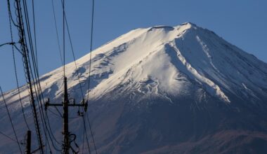 Close-up of Mt Fuji's snowcapped peak from October 2018. Zigzagging hiking trail visible on the left side.