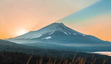 The setting sun hitting Mt Fuji at such a perfect angle that the summit literally splits the light in half.