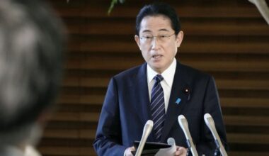 Kishida says will downgrade COVID-19 to less severe flu category in spring