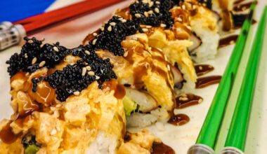 CA Roll topped with spicy shrimp, tobiko, and sesame seeds 😋.