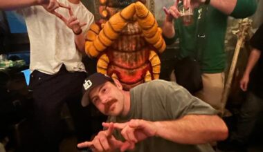 Kaiju wrestler Death Worm poses with United Empire, but has a little trouble with the hand sign