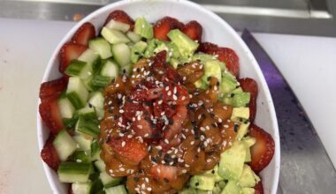 Salmon poke bowl with avocado, cucumber, and strawberry, a regular’s custom order