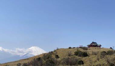 Mototsumiya Shrine atop Mt. Komagatake, with Mt. Fuji peeking from behind