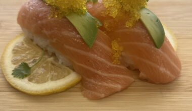 Salmon nigiri with yuzu tobiko.