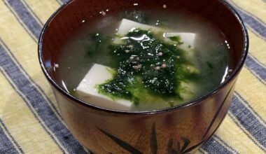 Miso soup with grass and tofu with a spoonful of sesame oil