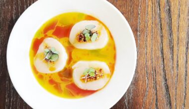 scallop crudo- local day boat scallops mandarin orange ponzu,aromatic oils,honey chili crisp