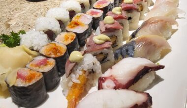 Octopus, mackerel, and yellowtail sashimi and spicy tuna and yellowtail along with surf and turf rolls