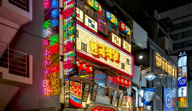 a bar in tokyo with neon signs