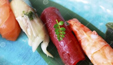 What is the name for the translucent thin sweet/sour flavored sheet that is sometimes placed on top of nigiri?