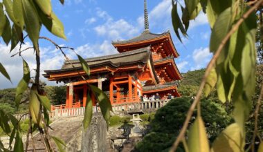 Photo from 6-Oct 2023 of Kiyomizu Dera temple entrance. Frame of leaves. All 3 primary colours - Red, Green and Blue in one pic