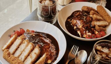 I made Japanese “omurice”. Slabs of roast pork katsu on a bed of chicken rice with omelette that we just flooded with black beef curry.