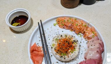 Sashimi- salmon, yellow tail and ahi with Jasmine rice, flying fish roe, scallions and furikake.