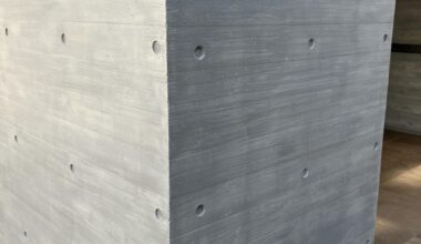 Why is this "concrete with the holes in it" wall pattern so popular on buildings in Tokyo?