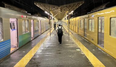 Train station at night in the rain.