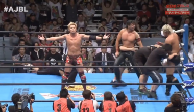 Okada keeps annoying Suwama with the Rainmaker pose