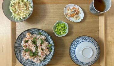 Mixed rice with salmon, cucumber, and umeboshi with sides and hojicha