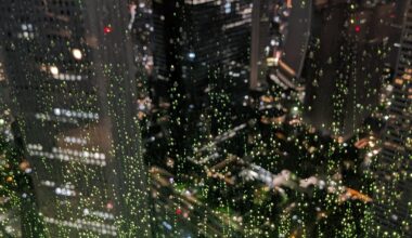 Rain seen from lit up Shinjuku skyscraper