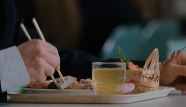 From Tokyo Drift movie, what is he eating in this scene?