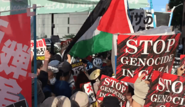 Japanese protesters chanted “Free, free Palestine” at the Israeli embassy in Tokyo. Police blocked the road with a steel fence. Protesters still trying to approach the embassy.