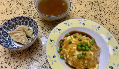 Tenshinhan (Crab Omelette Over Rice) with two veggie gyoza and radish and leek vegetable soup.