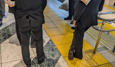 Guys with orange bands in Tokyo station